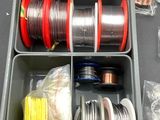 a container with many different types of wires in it