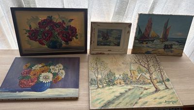 three paintings on a table with a vase of flowers