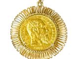 an image of a gold coin pendant with a woman ' s face on it