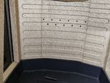 an image of the inside of a vehicle with the door open