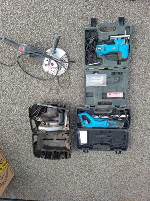 a box of tools sitting on the floor next to a box of tools