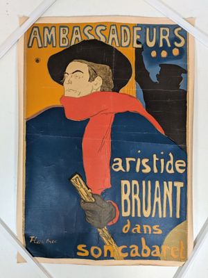 an old poster of a man in a hat and scarf holding a gun