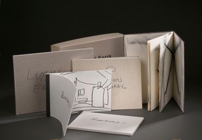 a folded book with a drawing of a man on it