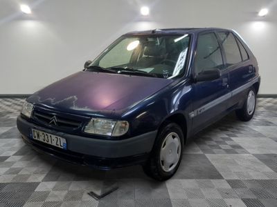 a picture of a blue car parked in a garage