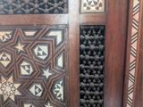 a close up of a wooden door with a pattern on it