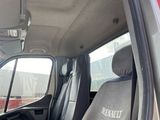 a red truck with two black seats in the back of it