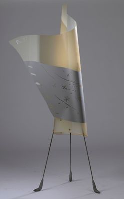 an image of a metal sculpture of a bird with a broken wing