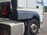 a white truck that is parked on the side of the road