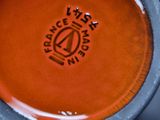 a close up of a coffee cup with a saucer on it
