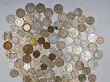 a lot of coins that are on the table