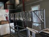 a room with a bunch of equipment hanging from the ceiling