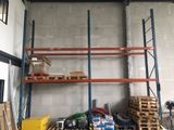 a room with a lot of shelves and pallets
