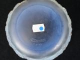 a small piece of paper in the middle of a plastic cup