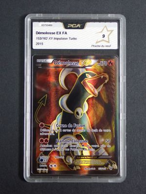 the pokemon card is in a plastic holder on a black surface