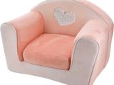 a pink chair with a white heart on it