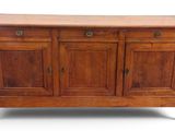 an image of a wooden sideboard with three doors and two drawers