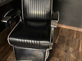 a black and white barber chair in a barber shop