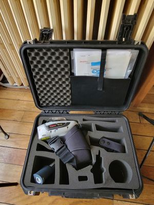 a black case with tools inside of it on the floor