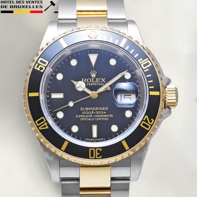 a rolex watch that is on display on a table