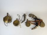 several different types of metal objects are displayed on a white surface