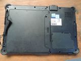a laptop that is sitting on a wooden table
