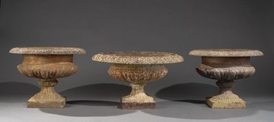 three vases sitting next to each other on a table