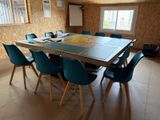 a table and chairs in a room with a wallpapered wall
