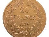une ancienne pièce française de 20 francs sur fond blanc