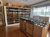 many bottles of wine on the shelves in this store
