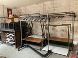 a room with a bunch of clothes hanging on a rack