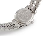 a close up of a wrist watch on a white surface
