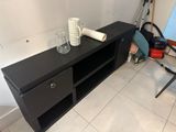 a picture of a black entertainment center in a living room