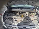 a car that has its hood open with the engine in it