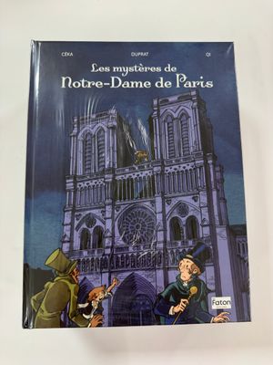 an image of a book with a picture of a man and a woman in front of a cathedral