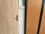 two doors that are open in a room