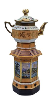 a teapot with a picture of a pagoda on it