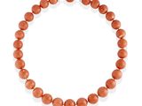 a coral beaded necklace on a white background