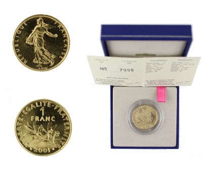 an image of a gold coin in a blue box with a pink ribbon