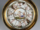 an image of a plate with an image of a woman and animals on it