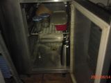 an image of a small refrigerator in a small kitchen
