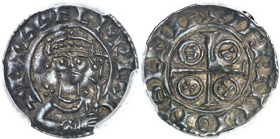 a close up of a coin with a face on it