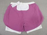 a close up of a pair of shorts with a tag on it
