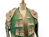 an image of a green and gold jacket on a mannequin