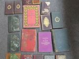 a lot of books that are on the floor