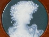 a picture of a woman with a wreath of flowers on her head