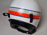 a white helmet with orange and blue stripes on it