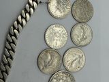 a lot of coins that are laying on a table