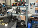 a workbench with a lot of tools on top of it