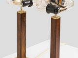 pair of brass and glass table lamps on wooden bases