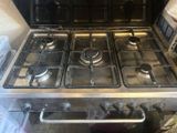 four burners on the stove in the kitchen